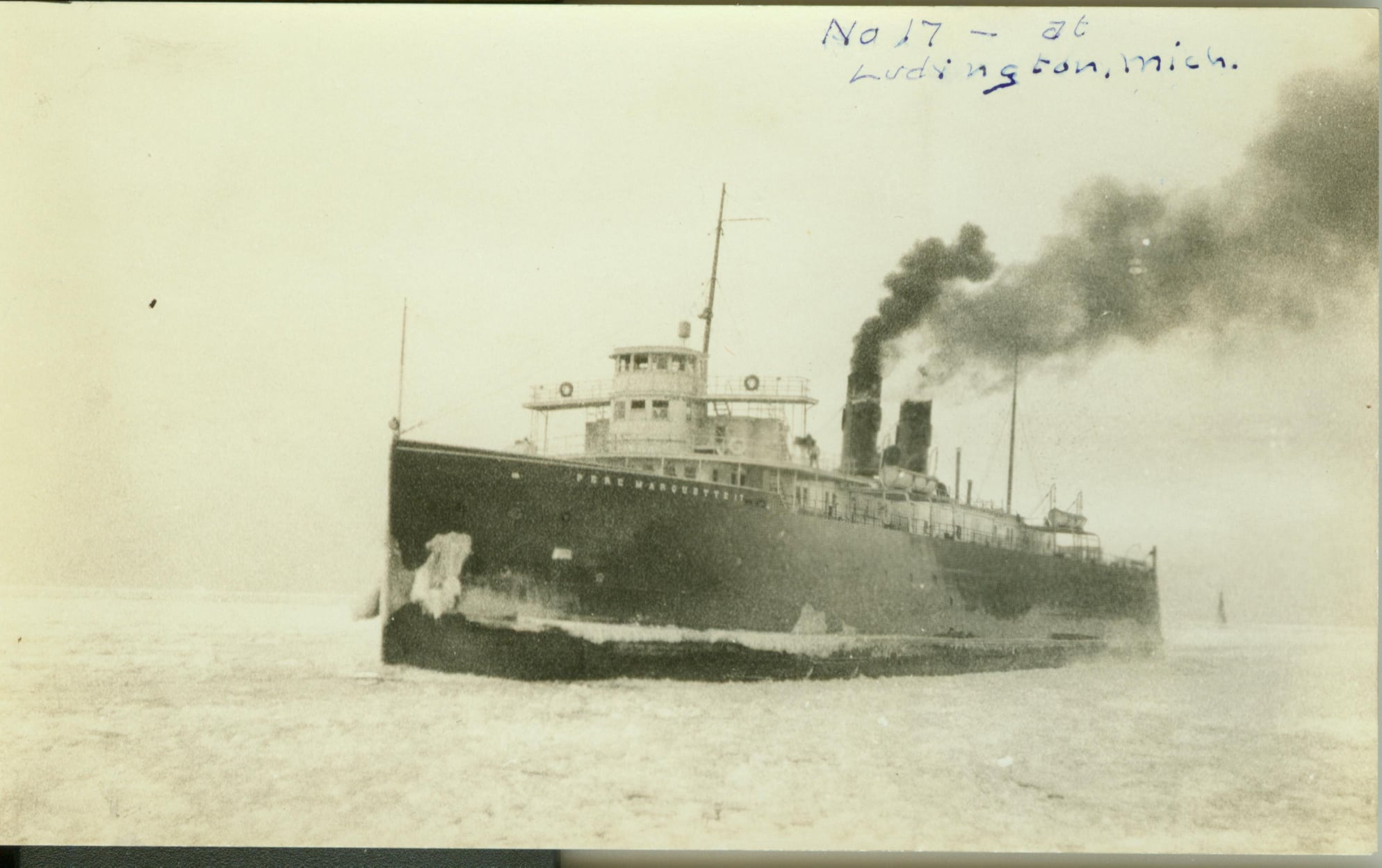 a vintage photo of a large ship in a body of water