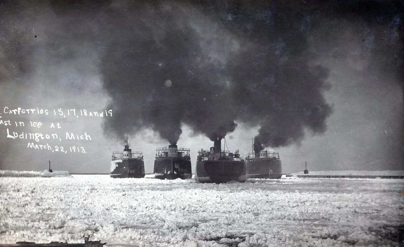 a train on a track with smoke coming out of it