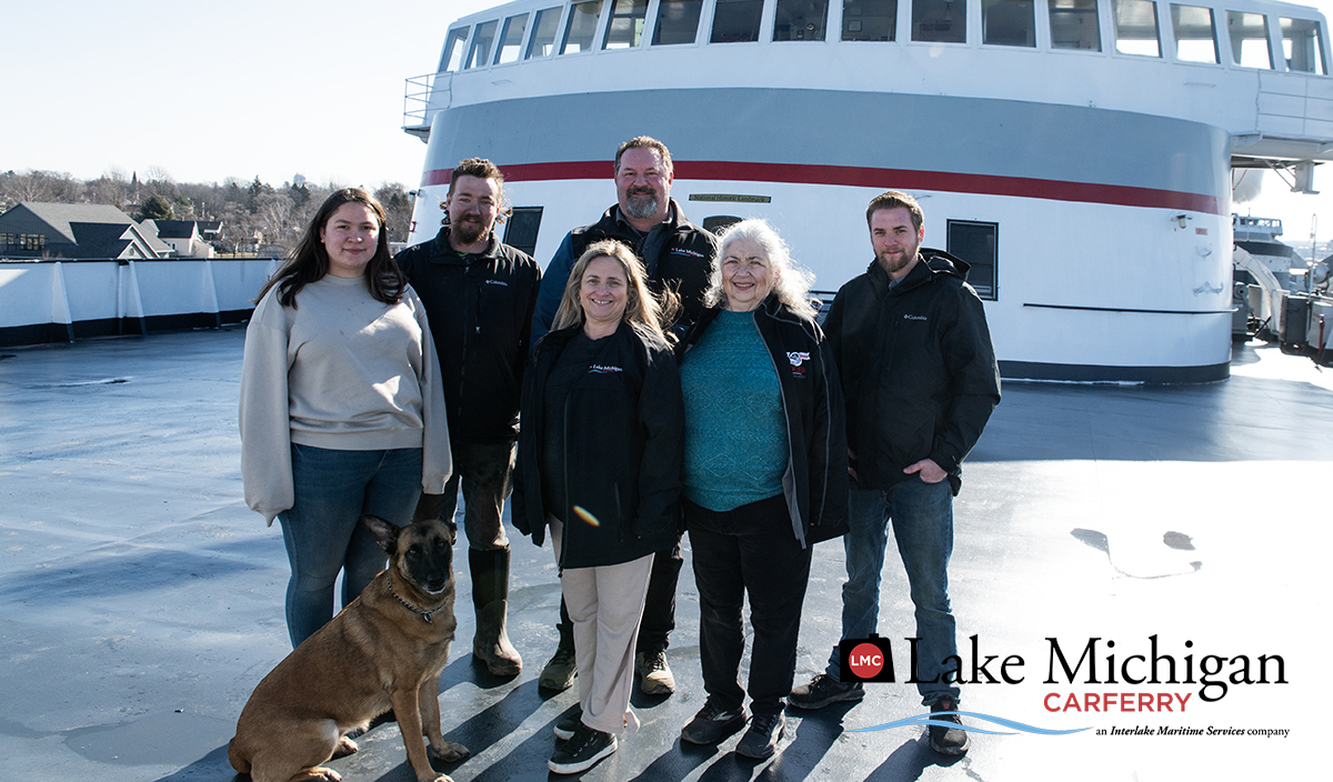 03-10-25 poort family 2 LR a group of people standing next to a dog