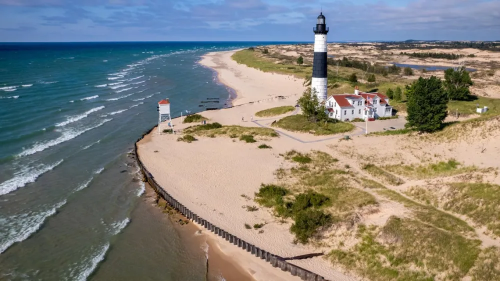 Sprawling aerial view of Ludington State Park, Big Sable Lighthouse, and Lake Michigan
