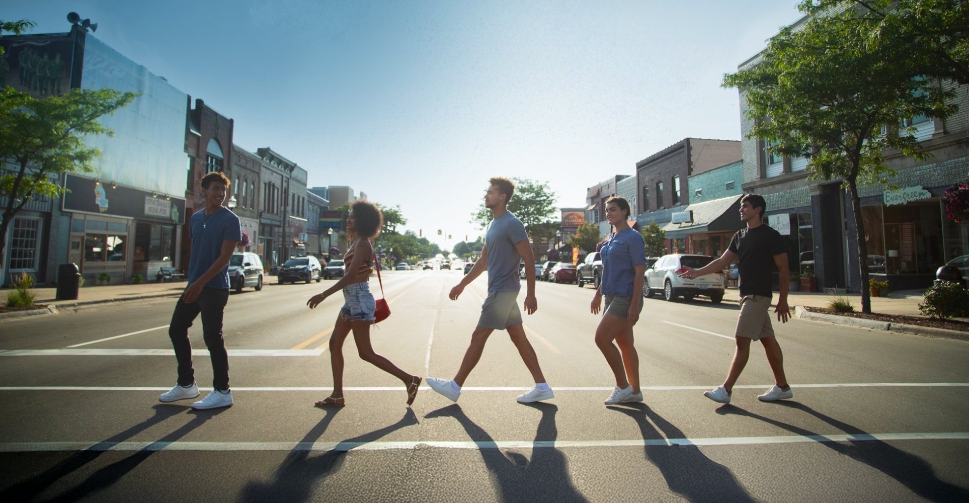 a group of people walking down the street