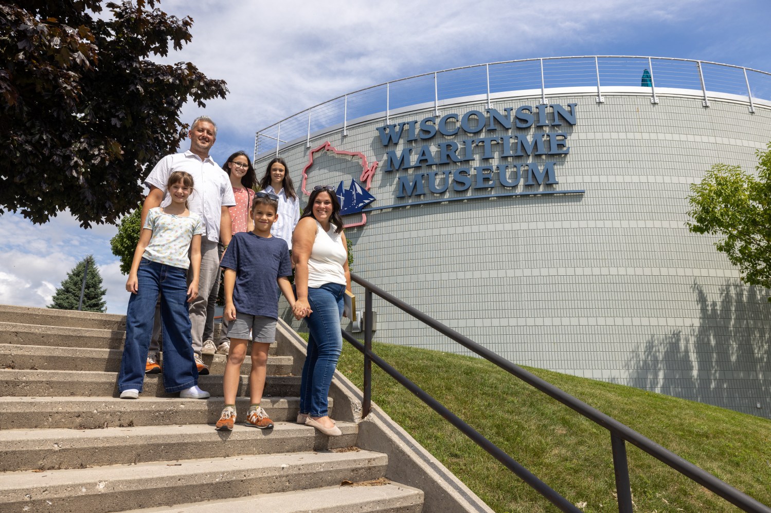 Family of six standing on stairs outside Wisconsin Maritime Museum